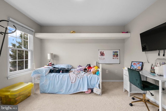 bedroom featuring carpet floors and baseboards