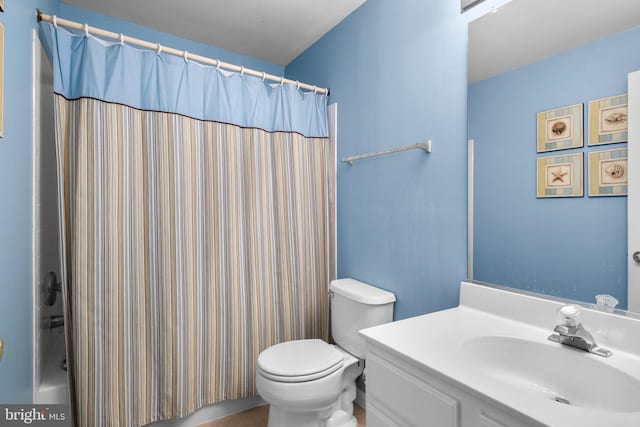 bathroom with toilet and vanity