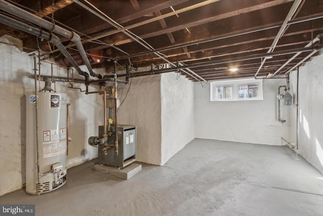 below grade area featuring water heater and a heating unit