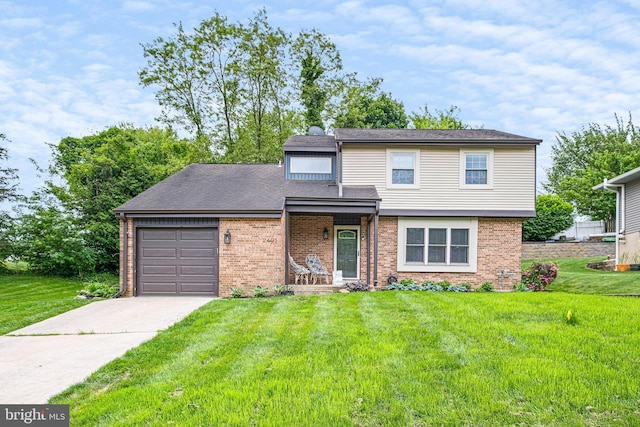 traditional-style home featuring a front yard, brick siding, driveway, and an attached garage