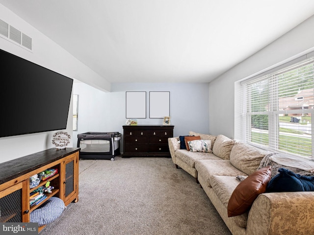 living area with carpet and visible vents