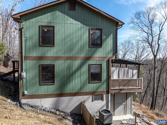 view of side of home with cooling unit