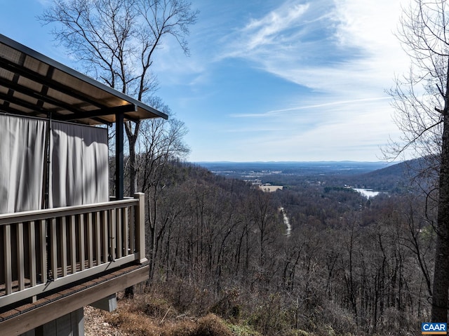 property view of mountains featuring a forest view