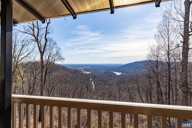 exterior space featuring a forest view