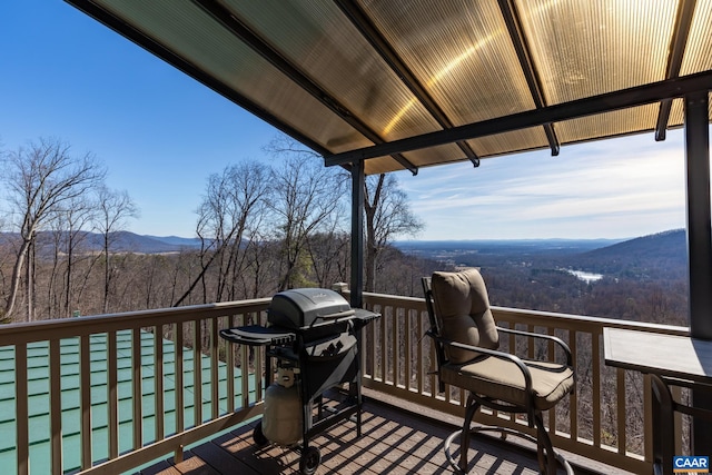 deck featuring a mountain view and area for grilling