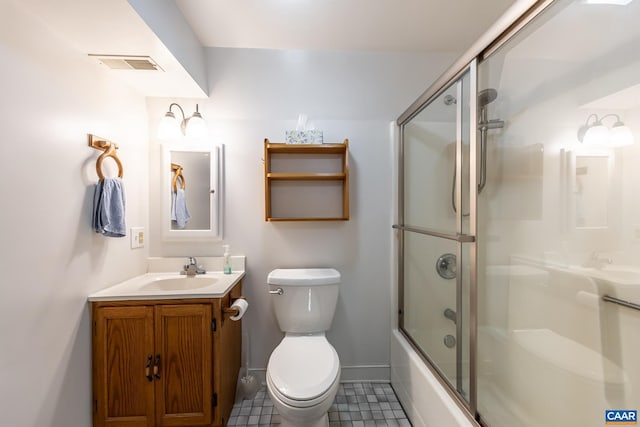 bathroom featuring visible vents, toilet, shower / bath combination with glass door, tile patterned flooring, and baseboards