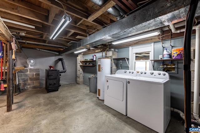 unfinished basement with washer and dryer and electric water heater