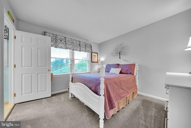 bedroom featuring carpet floors and baseboards