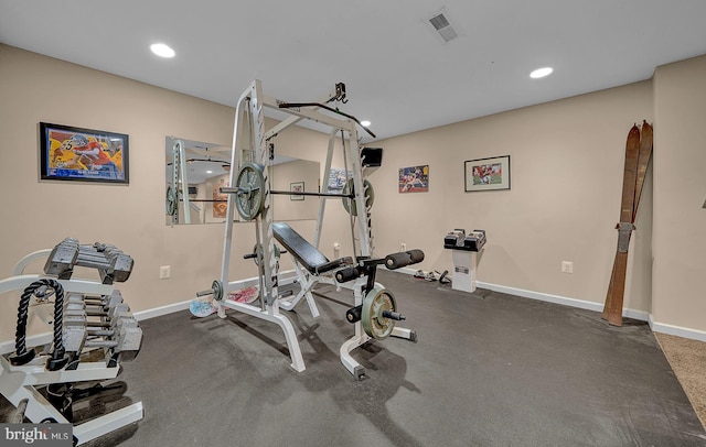 workout area featuring baseboards, visible vents, and recessed lighting