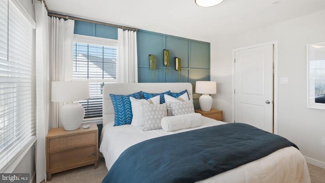 bedroom with carpet floors and baseboards