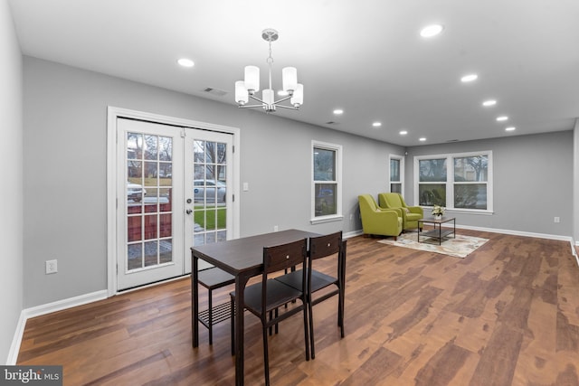 dining space with baseboards, french doors, wood finished floors, and recessed lighting