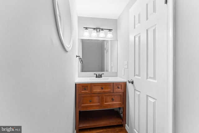 bathroom featuring wood finished floors and vanity