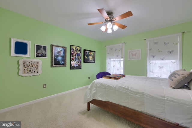 bedroom featuring carpet flooring, a ceiling fan, and baseboards