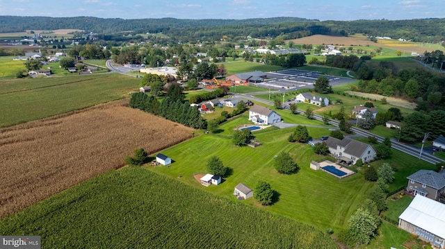 birds eye view of property featuring a rural view