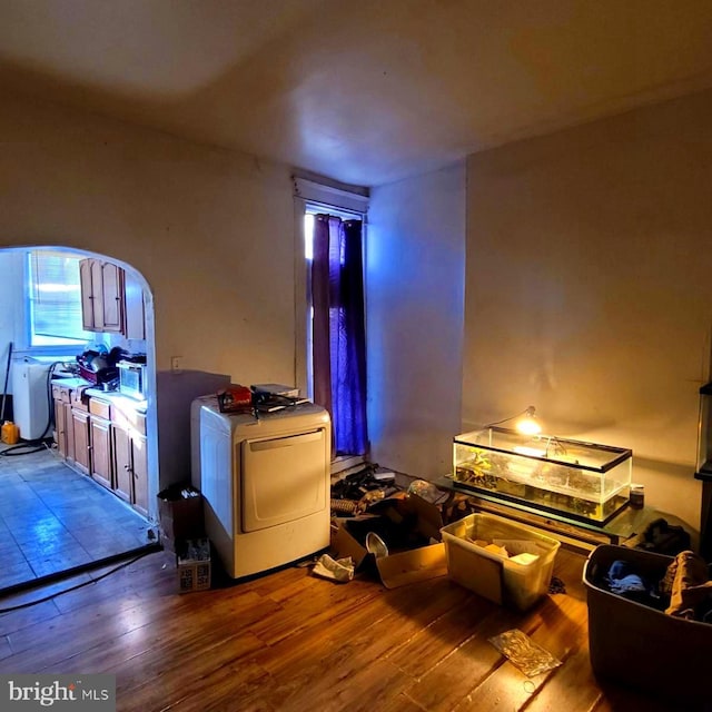 interior space with washer / clothes dryer and hardwood / wood-style floors