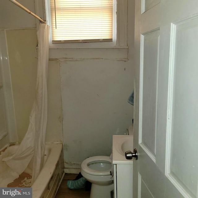 full bathroom with toilet, shower / bath combo, and vanity