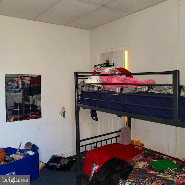 bedroom featuring a drop ceiling