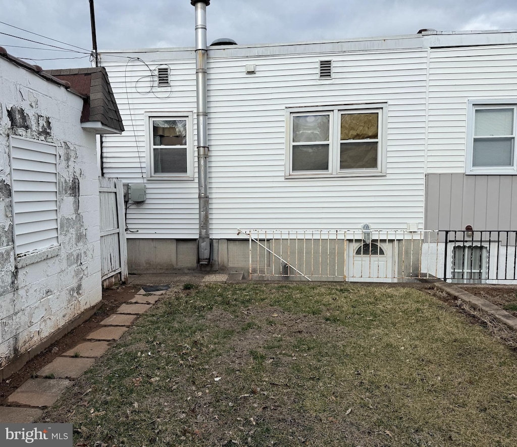 view of property exterior featuring a yard