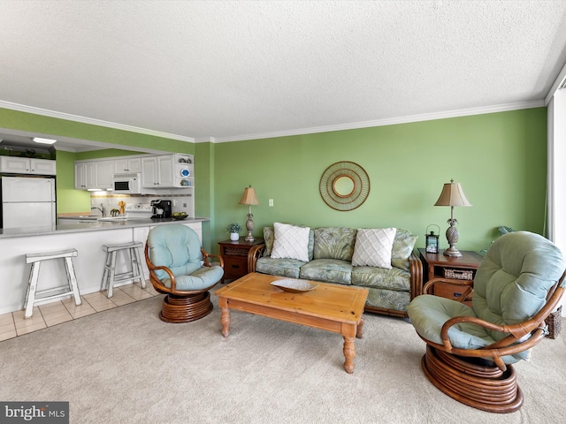 8500 Coastal Hwy Unit 107, Ocean City, MD 21842 - living room with light tile patterned floors, ornamental molding, light colored carpet, and a textured ceiling