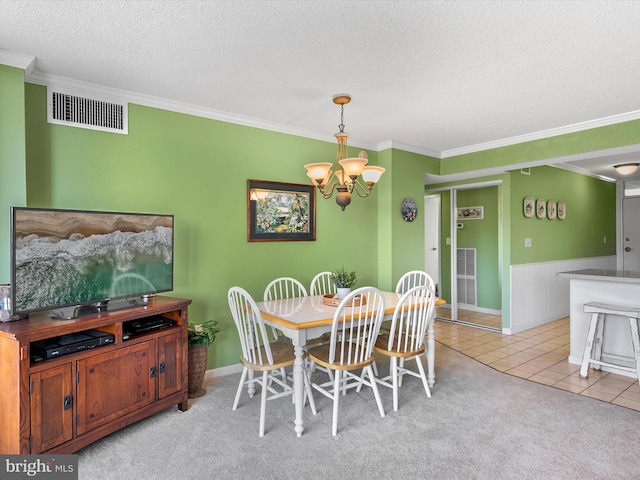 8500 Coastal Hwy Unit 107, Ocean City, MD 21842 - dining room with light colored carpet, light tile patterned floors, a chandelier, a textured ceiling, and visible vents