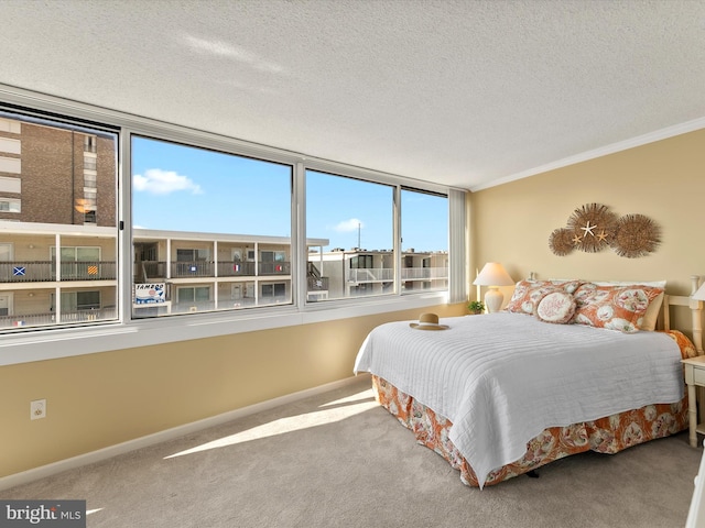 8500 Coastal Hwy Unit 107, Ocean City, MD 21842 - carpeted bedroom featuring crown molding, baseboards, and a textured ceiling