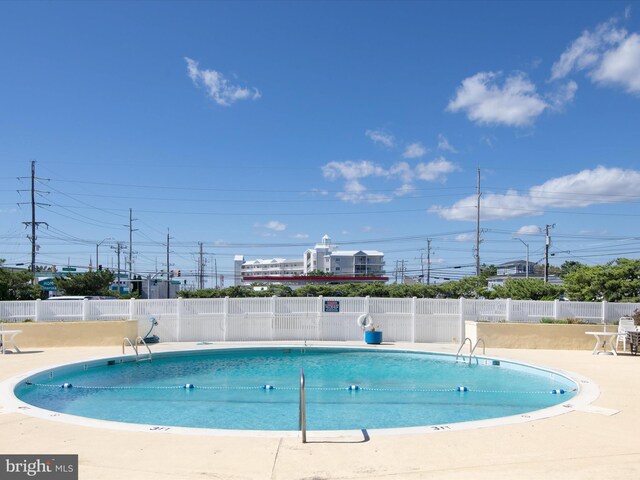 8500 Coastal Hwy Unit 107, Ocean City, MD 21842 - pool featuring a patio and fence