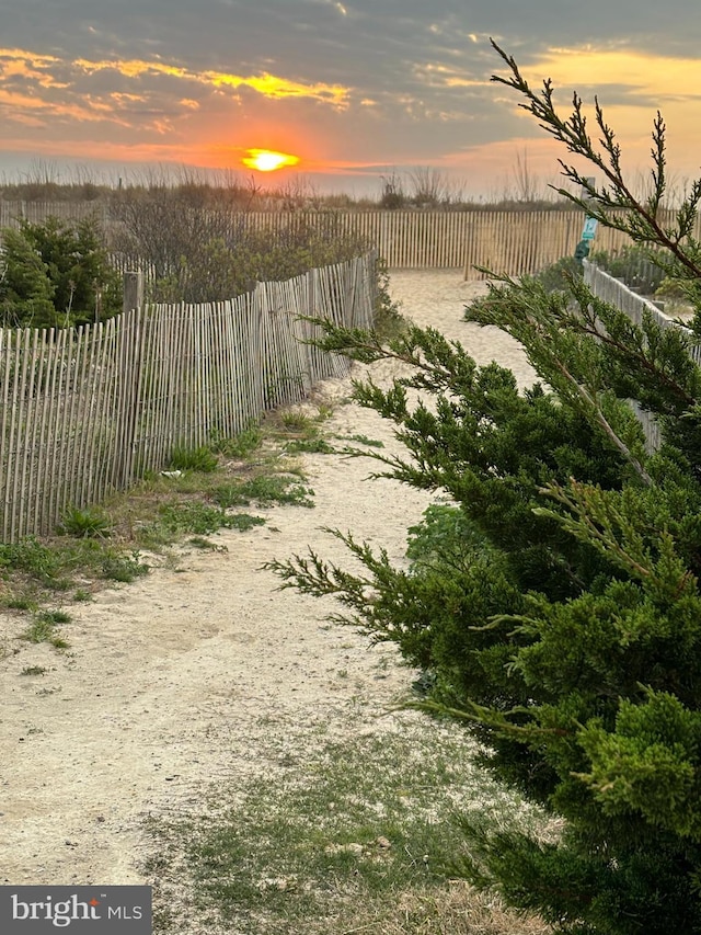 8500 Coastal Hwy Unit 107, Ocean City, MD 21842 - yard at dusk with fence