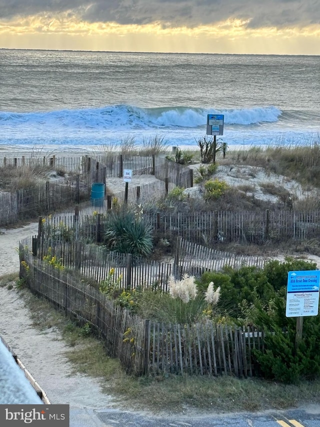 8500 Coastal Hwy Unit 107, Ocean City, MD 21842 - property view of water featuring fence and a beach view