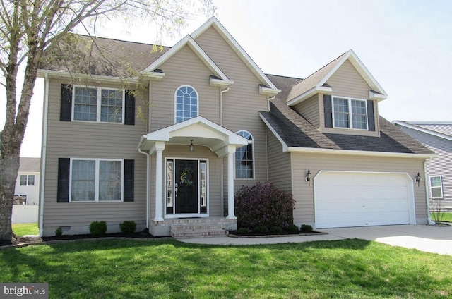 view of front of property with an attached garage, concrete driveway, roof with shingles, and a front yard