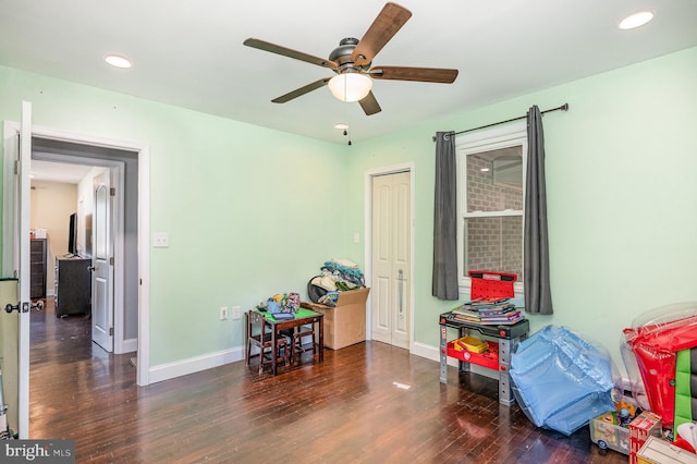 recreation room with recessed lighting, a ceiling fan, baseboards, and wood finished floors