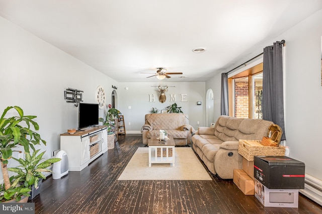 living area featuring visible vents, arched walkways, wood finished floors, and a ceiling fan