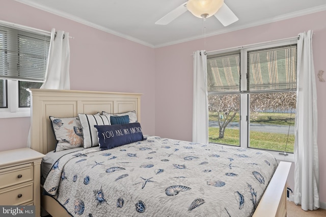 bedroom with ceiling fan and ornamental molding