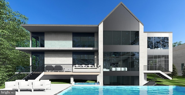 back of property with brick siding, an outdoor pool, and stairway