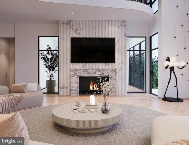 living area featuring parquet floors, a premium fireplace, and recessed lighting