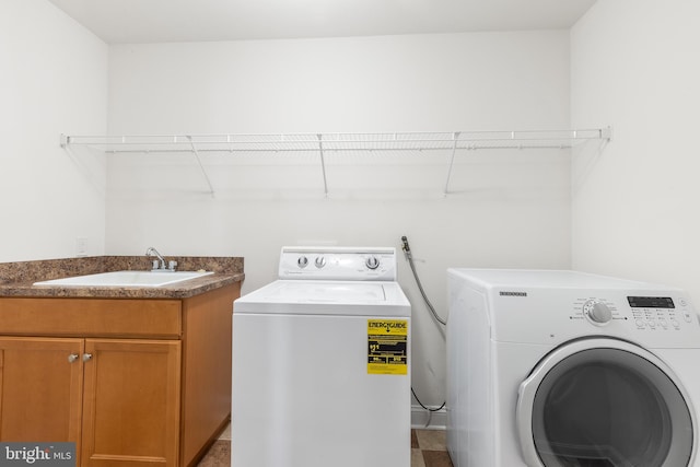 laundry room with a sink and washer and dryer