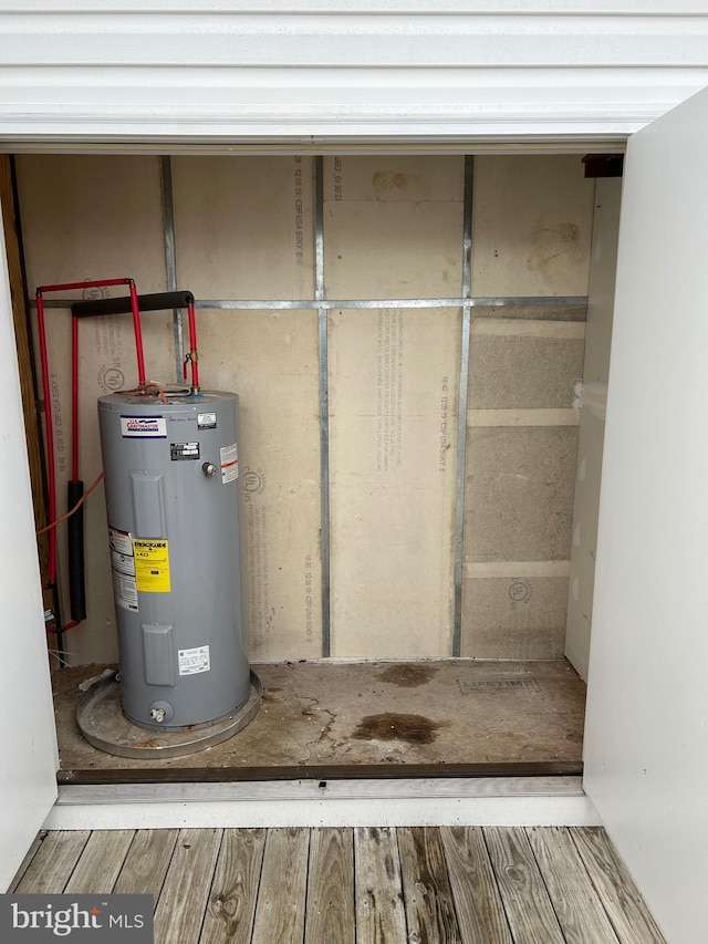 utility room with electric water heater