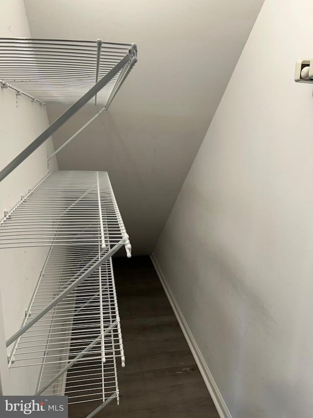 interior space featuring wood finished floors and baseboards