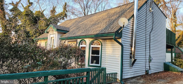 view of front of house with a shingled roof