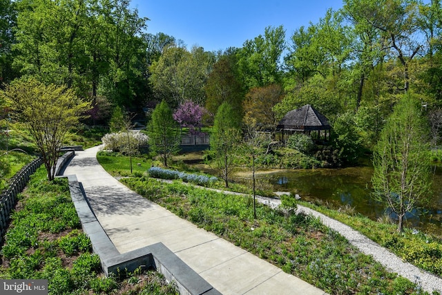 surrounding community featuring a gazebo and fence