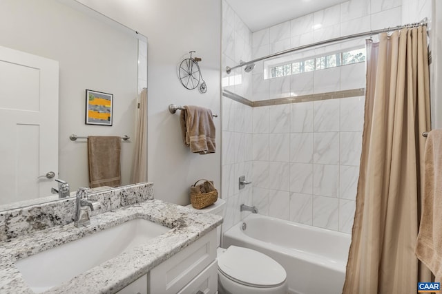 bathroom with toilet, shower / bath combo with shower curtain, and vanity