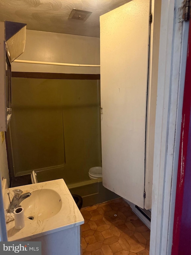 bathroom featuring tile patterned floors and vanity