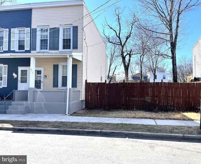 view of side of property featuring fence