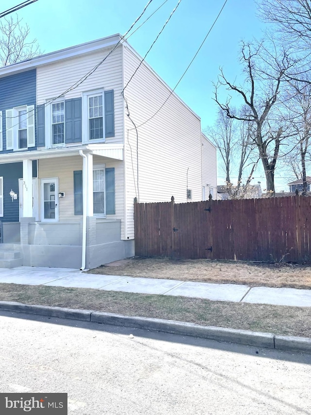 view of home's exterior featuring fence