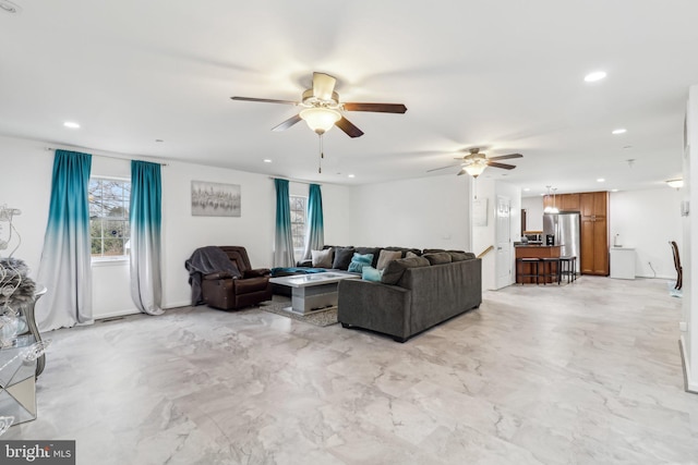 living area with ceiling fan and recessed lighting