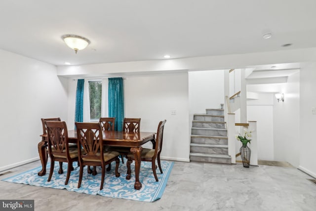 dining room with recessed lighting, baseboards, and stairs