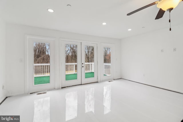 spare room featuring a wealth of natural light, french doors, visible vents, and recessed lighting