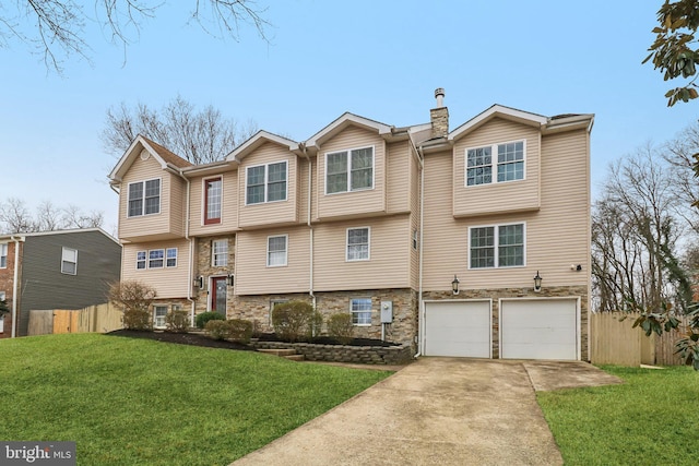 view of front of house featuring a chimney, a front yard, fence, stone siding, and driveway