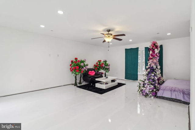 interior space with a ceiling fan and recessed lighting