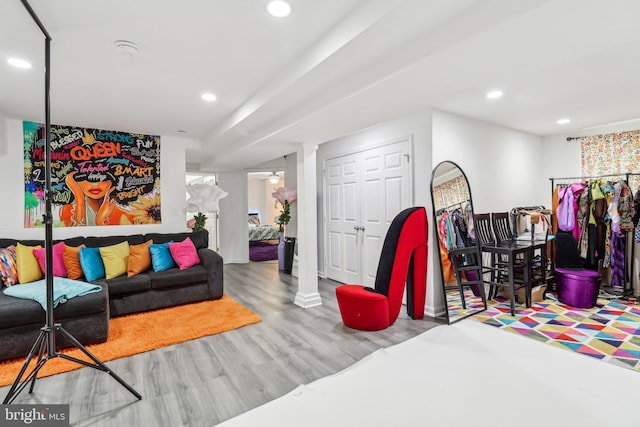 living area featuring ceiling fan, wood finished floors, and recessed lighting