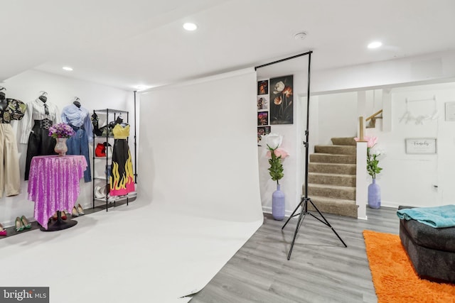 interior space with stairway, wood finished floors, and recessed lighting